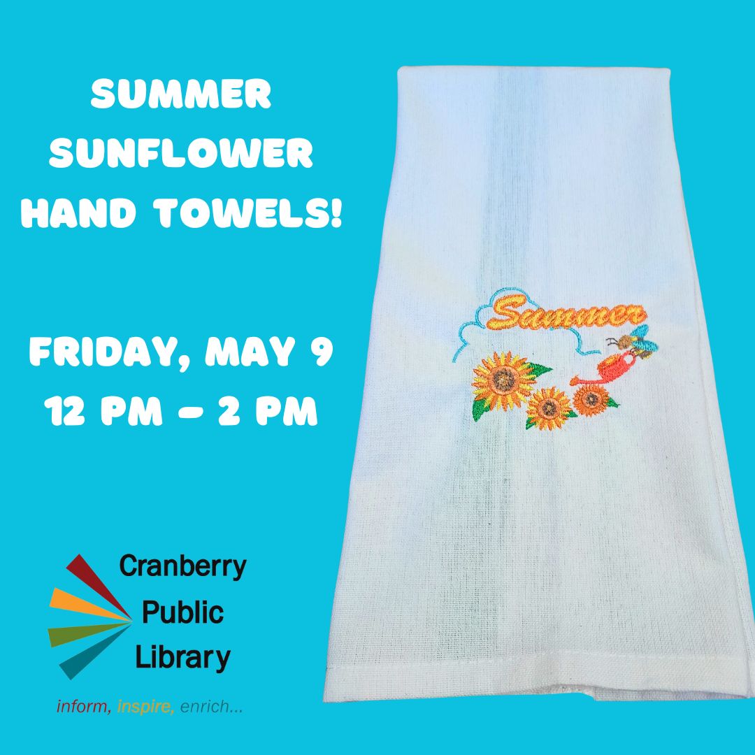 Image of a white hand towel with an embroidered sunflower design