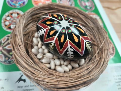 Image of a 5 color pysanky egg in a next